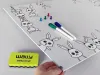 Dry-erase magnetic board for kids featuring rabbits - Graphic design with rabbit illustrations on a white background.
