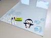 Dry-erase magnetic board for kids featuring a penguin and ice on a blue background.