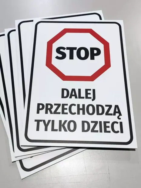 Stop Sign: Only children may pass. Round shape with red border and black text.