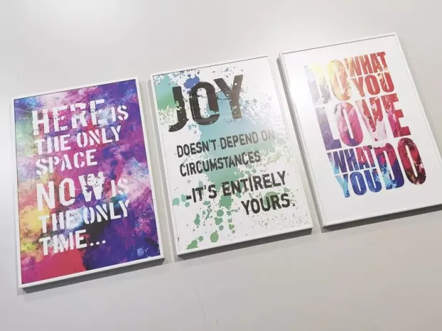 Set of 3 individual A3 posters in a white aluminum frame - graphic design with text in various colors.