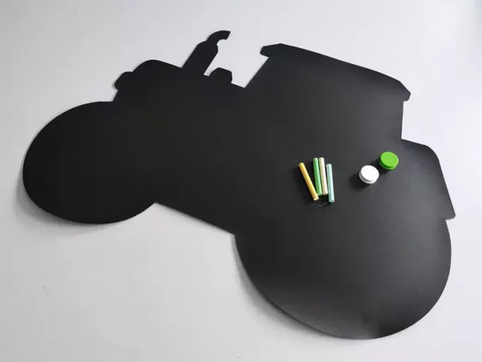 Chalkboard magnetic board for kids, tractor design with cut-out details and crayons.