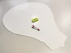 Dry-erase magnetic board in the shape of a light bulb with clear contours.