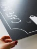 Personalized chalkboard with a 5mm PVC backing, 65x90 cm, featuring a graphic design in black.