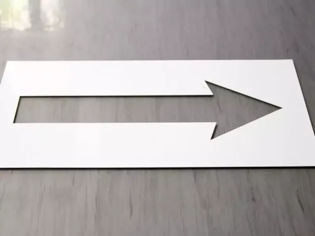 Reusable 3mm PVC painting template featuring a graphic design in the shape of an arrow.