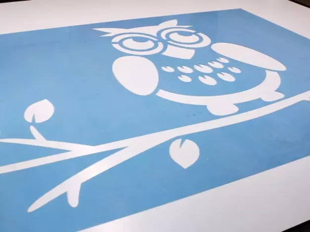 Reusable owl painting stencil on a branch - Graphic design. Owl with round eyes and large wings.