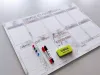 Weekly planner dry-erase magnetic board 414 - Graphic design. Rectangular layout with space for days of the week.