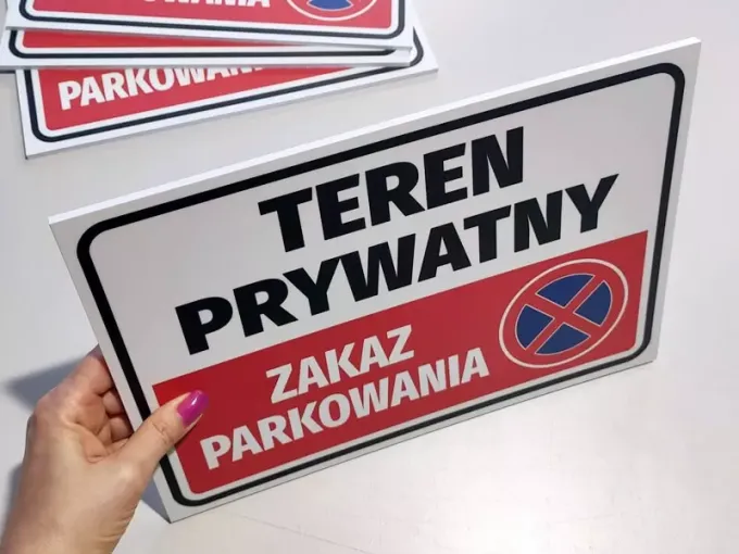 Private Property Sign, No Parking - Graphic Design. Red background with white text and prohibition symbol.