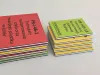 Double-sided printed magnet with a 2mm PVC core, featuring a graphic design in yellow, green, and red.