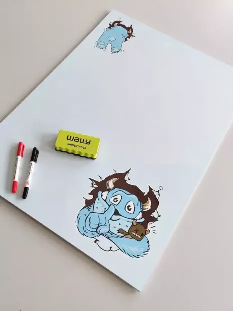 Dry-erase magnetic board for kids featuring a blue monster design.