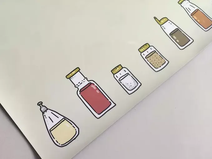 Magnetic dry-erase board for the kitchen with a spice design featuring bottles of various spices.