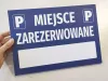 Reserved parking sign with space for vehicle registration number - Graphic design. Blue background with white text.