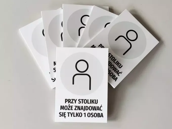 Sign indicating only 1 person can sit at the table - Graphic design features an icon of a person on a white background.