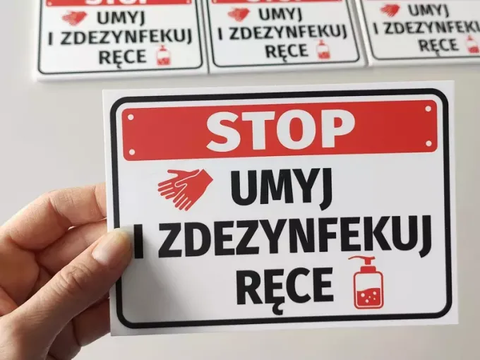 Hand Wash and Disinfect Sign - Graphic design with red "STOP" text, hand graphic, and bottle on a white background.