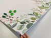 Magnetic whiteboard branches 570 - Features a design with green leaves and pink flowers.