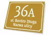 House number plaque, street - Graphic design. Rectangular plaque with white text on a gold background.