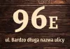 House sticker N671 with number and street - Graphic design. Large digit 96E on a wooden texture background, name below.