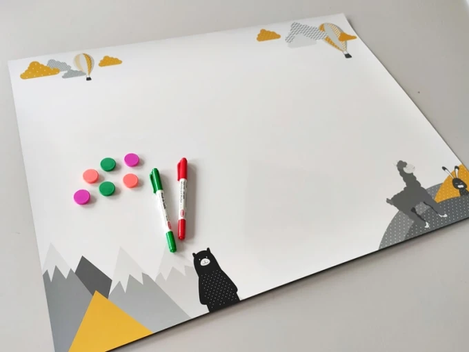 Dry-erase magnetic board with an alpaca bear design. Features colorful mountain elements on a white background.