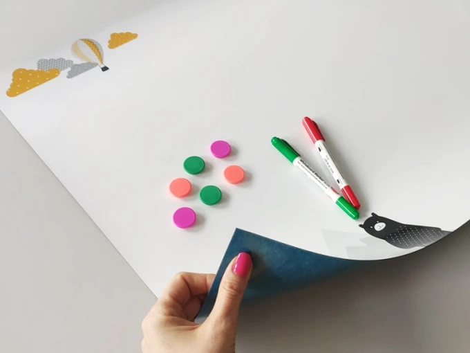 Dry-erase magnetic board with alpaca bear design. Features clouds and balloons at the top, bear character at the bottom.