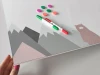 Magnetic dry-erase board featuring a bear, mountains, and balloons in gray shades.