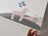 Dry-erase magnetic board with a cute bear and balloons, perfect for a colorful children\'s room.