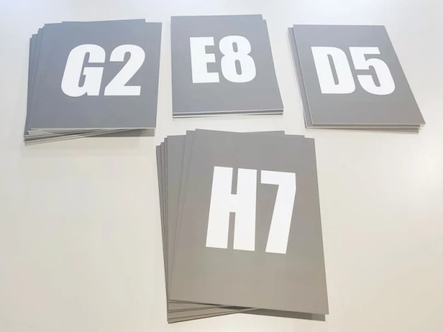 Custom information plaque with PVC backing - Graphic design. White letters on gray background, various labels.