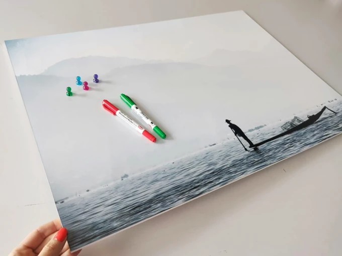 Magnetic whiteboard fisherman 253 - Graphic design featuring a fisherman on water with mountains and fog in the background.