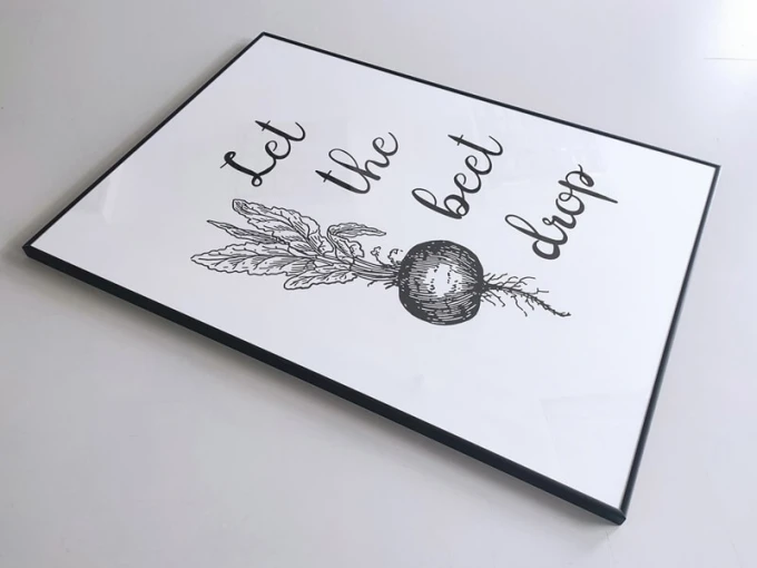 Let the beet drop poster 248 - Graphic design featuring a beet with leaves on a white background and text.