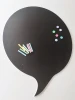 Chalkboard magnetic board in speech bubble shape with chalk and colorful magnets.