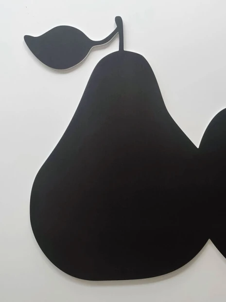 Pear-shaped chalkboard magnetic board, perfect for a modern office or cozy room.