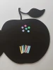 Chalkboard magnetic board in apple shape with colorful dots and crayons design.