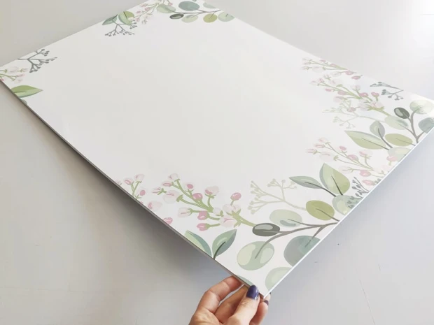 Dry-erase board branches 570 - Graphic design featuring delicate branches with green leaves and pink accents.