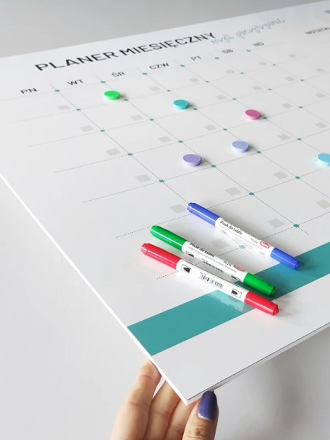 Monthly planner dry-erase board 469 - Graphic design. Simple grid with days of the week and colorful markers.