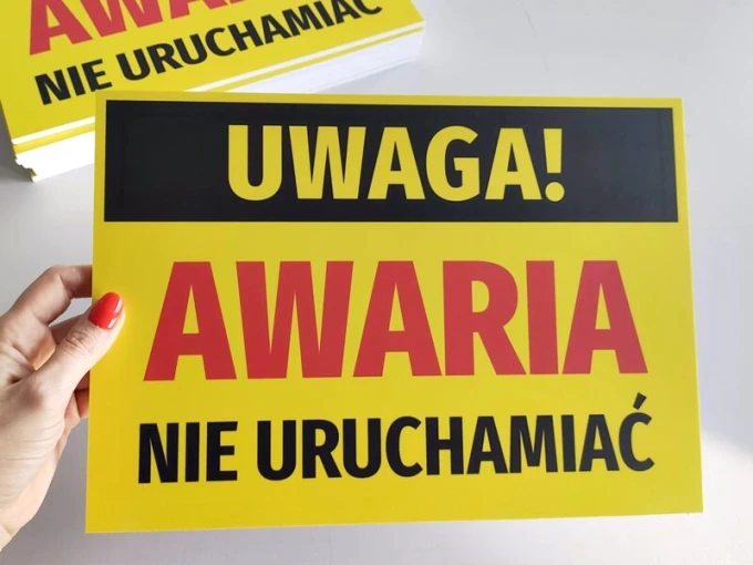 Caution: Do not operate - Graphic design. Yellow background with large black and red letters.