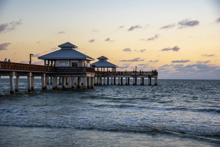 Sunset pier wall mural FP 6401 - Living room decor. Walls in shades of blue and beige.
