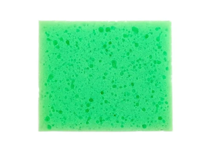 Chalkboard sponge - Graphic design. Simple rectangular shape in green with small holes.