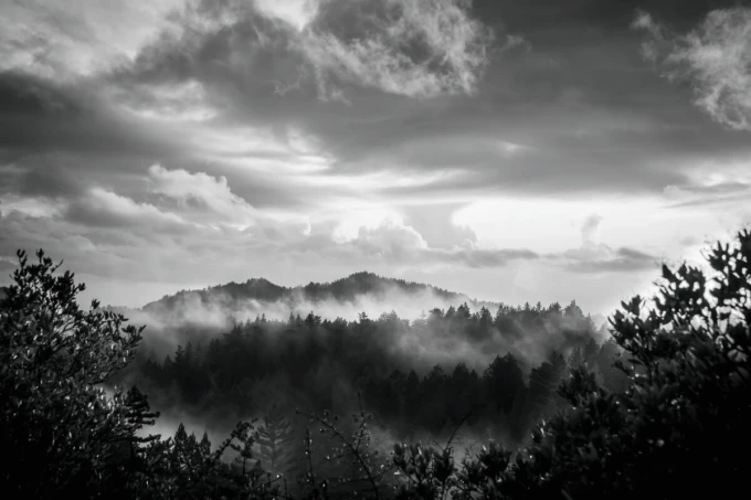 Wall mural colorful clouds over mountains FP 6457 - Graphic design. Clouds in various shades of gray over dark.