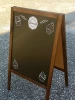 Chalkboard A-frame sign with custom print - Graphic design featuring cupcake illustrations on a dark background.
