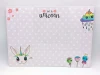 Dry-erase magnetic board for kids featuring unicorn design with drawings on a background of white stars.