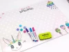 Dry-erase magnetic board for kids featuring a unicorn design with unicorn drawings visible on the board.