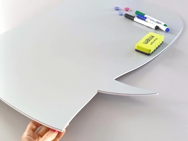Dry-erase magnetic wall board in speech bubble shape with cutout design.