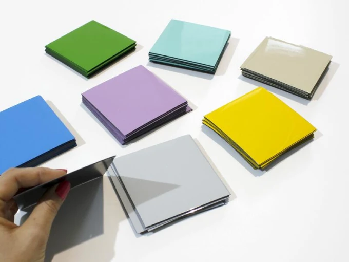 Custom dry-erase magnets in small sizes - Graphic design. Square magnets in various colors stacked together.