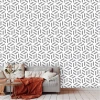 Geometric pattern wallpaper 0162 for living room. Light-colored walls and gray furniture arrangement.