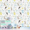 Stork wallpaper with toys and baby clothes design featuring storks, toys, clouds, and sun in pastel colors.