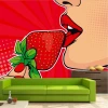 Pop-art strawberry lips wallpaper 0393 - Modern living room decor with red walls and a green sofa.