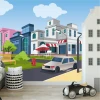 Boys\' room wallpaper featuring street intersections, buildings, and cars. Brightly colored walls for a playful decor.
