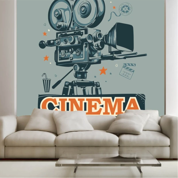 Cinema wallpaper featuring a retro film camera illustration, styled in a living room with gray walls and a light sofa.