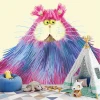 Colorful cat wallpaper for kids\' room, styled with light-colored walls and furniture.