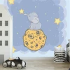 Elephant, moon, and stars wallpaper for children\'s room - bright walls and furniture arrangement.