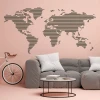 Stylish world map in minimalist design perfectly complements a modern pink-themed living room.