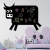 Chalkboard magnetic board for kids, cow design 001 - Black cow-shaped board with colorful drawings.